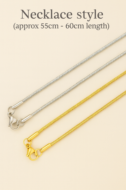 Silver and gold snake chain necklaces with lobster clasps on beige background, 55-60cm length