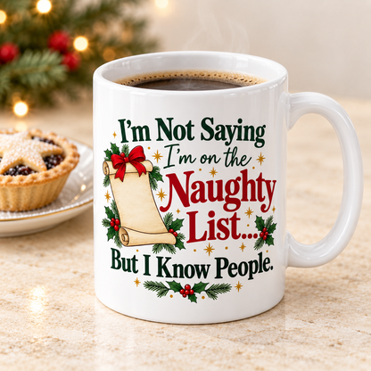 Naughty List white 11oz ceramic mug, elevated three-quarter view