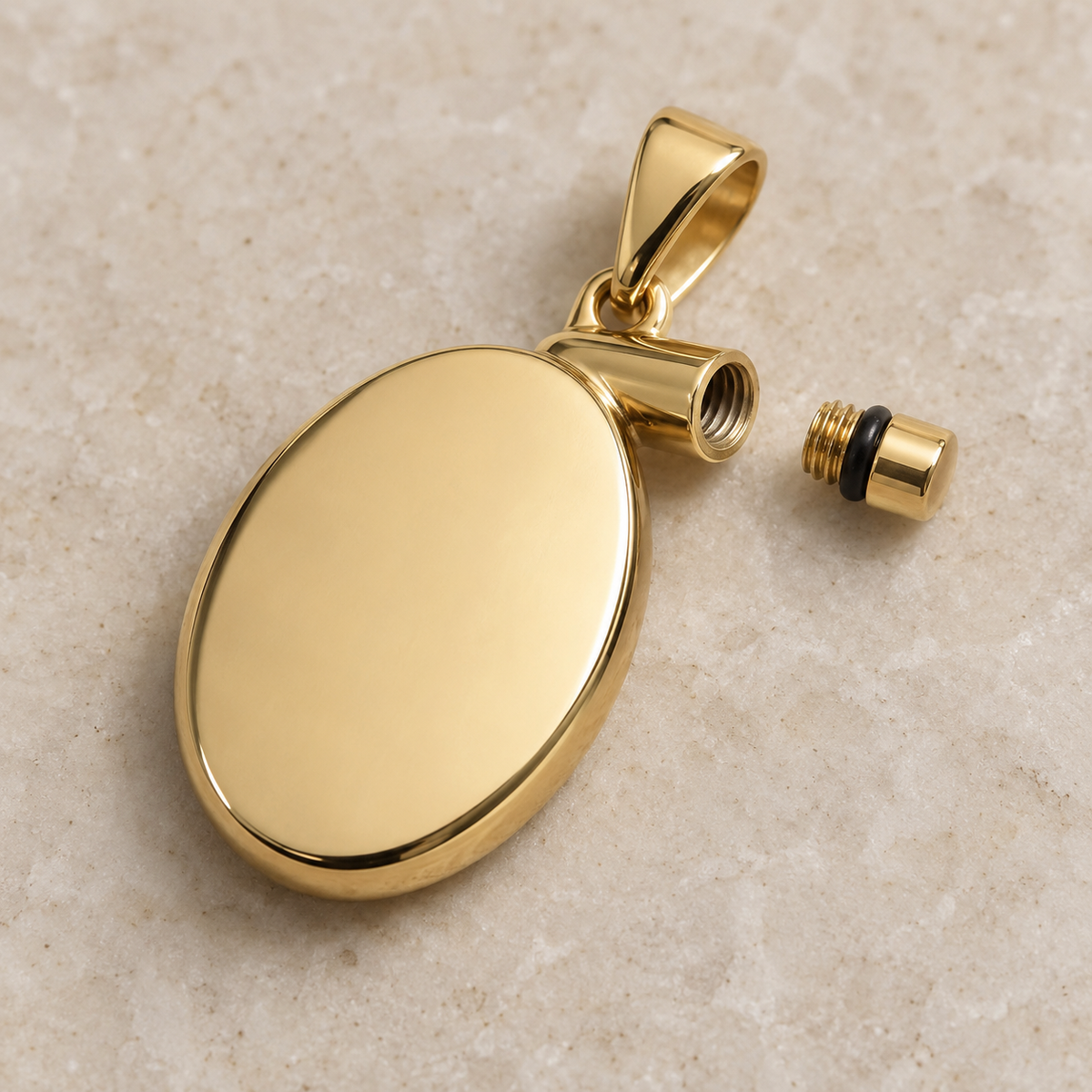 Gold oval pet keepsake pendant with screw-sealed capsule for hair or ashes, shown open