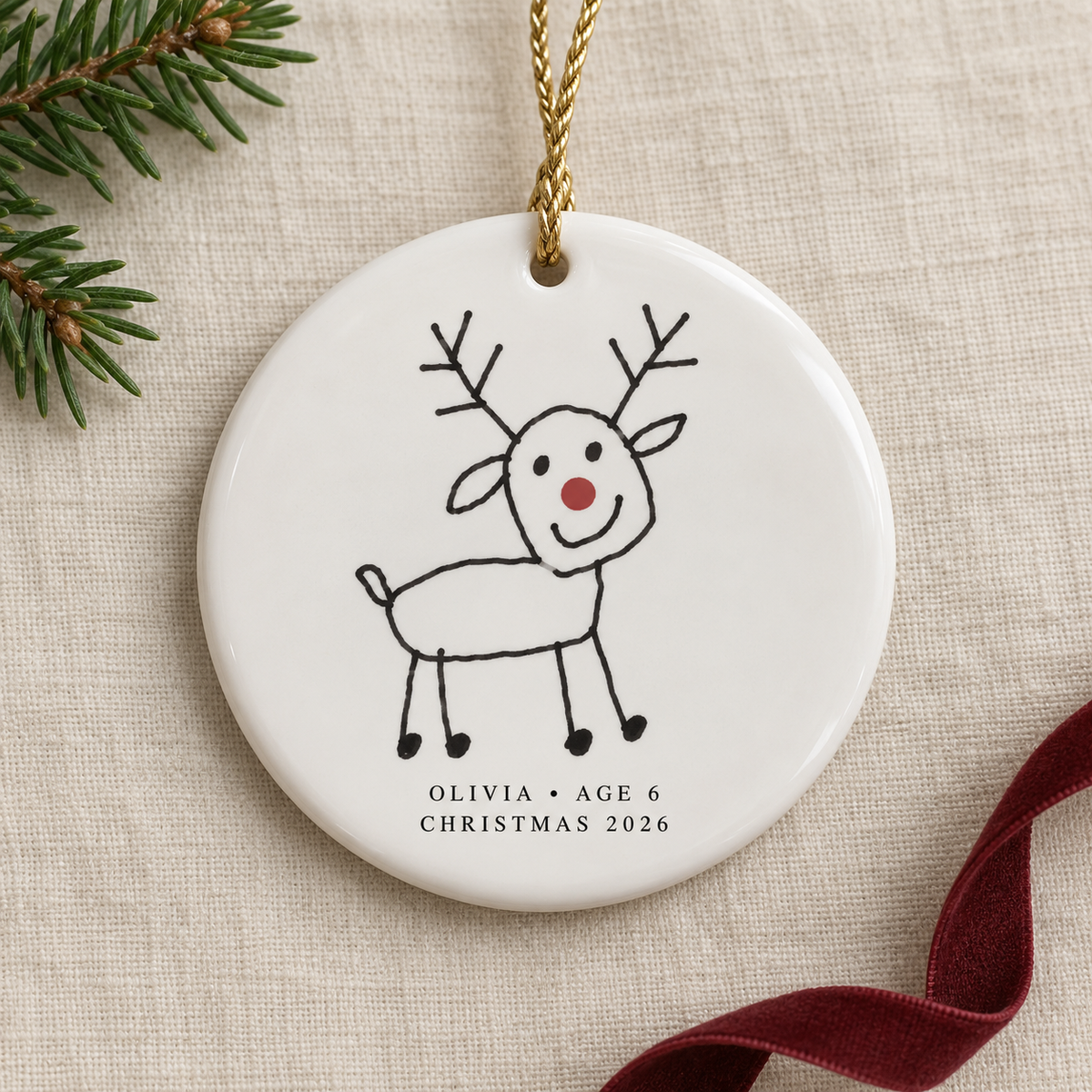 Minimal round Christmas ornament featuring Olivia's hand-drawn reindeer