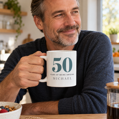 Man holding personalised 50th birthday mug with the name Michael