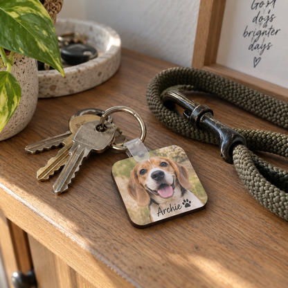 Personalised dog photo keychain beside house keys and dog lead