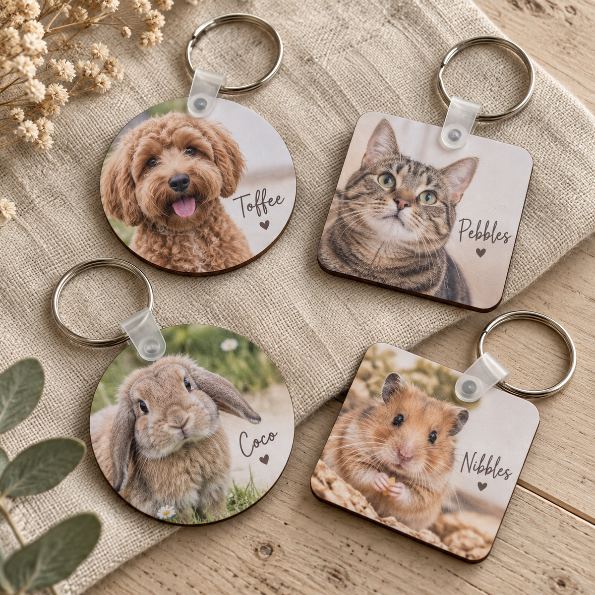 Four personalised pet photo keychains featuring dogs cats rabbit and hamster
