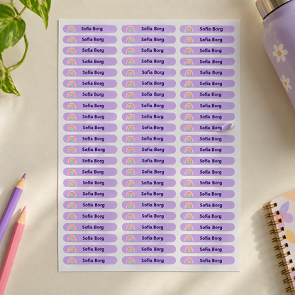 Full sheet of lilac personalised school name stickers with rainbow icon