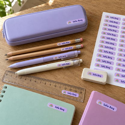 Personalised school name stickers applied to stationery and pencil case