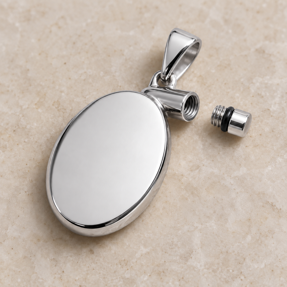 Silver oval pet keepsake pendant with screw-sealed capsule for hair or ashes, shown open